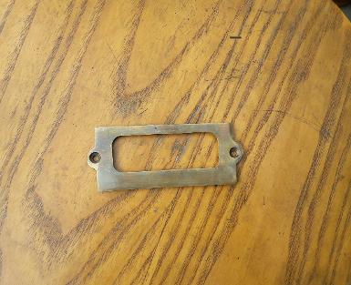 Brass Label Holder Item Code J.035C size long 100 mm. wide 41 mm. Brass Label Holder Item Code J.035C size long 100 mm. wide 41 mm.